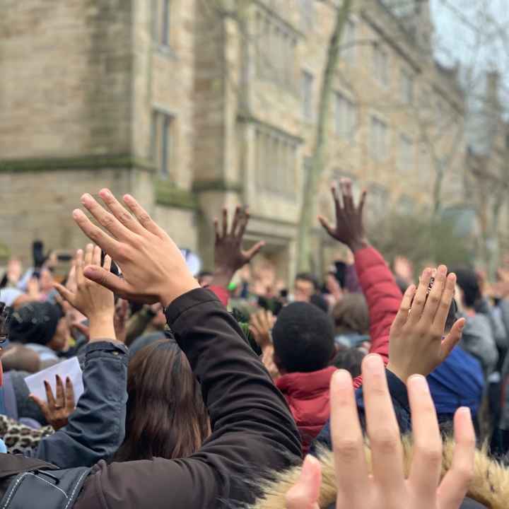 Protesters in New Haven stand in "hands up don't shoot" position protesting Hamden and Yale police shooting of Stephanie Washington and Paul Witherspoon
